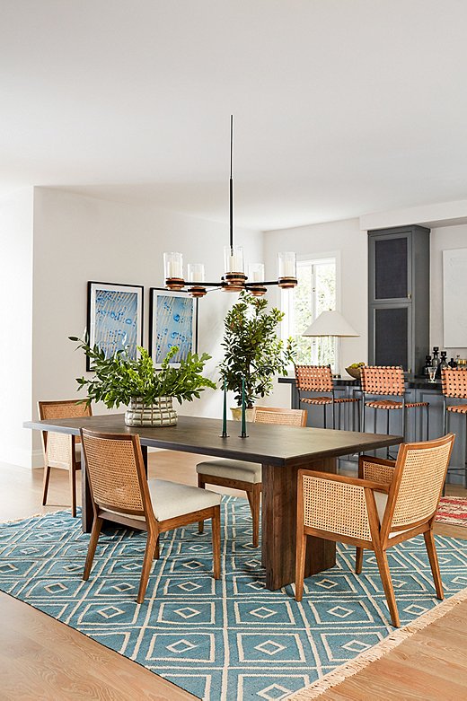 Don’t feel limited to earth tones when choosing a Naturalist rug. This rug has a blue ground but still feels blissfully organic. Find the side chairs here and the armchairs here.

